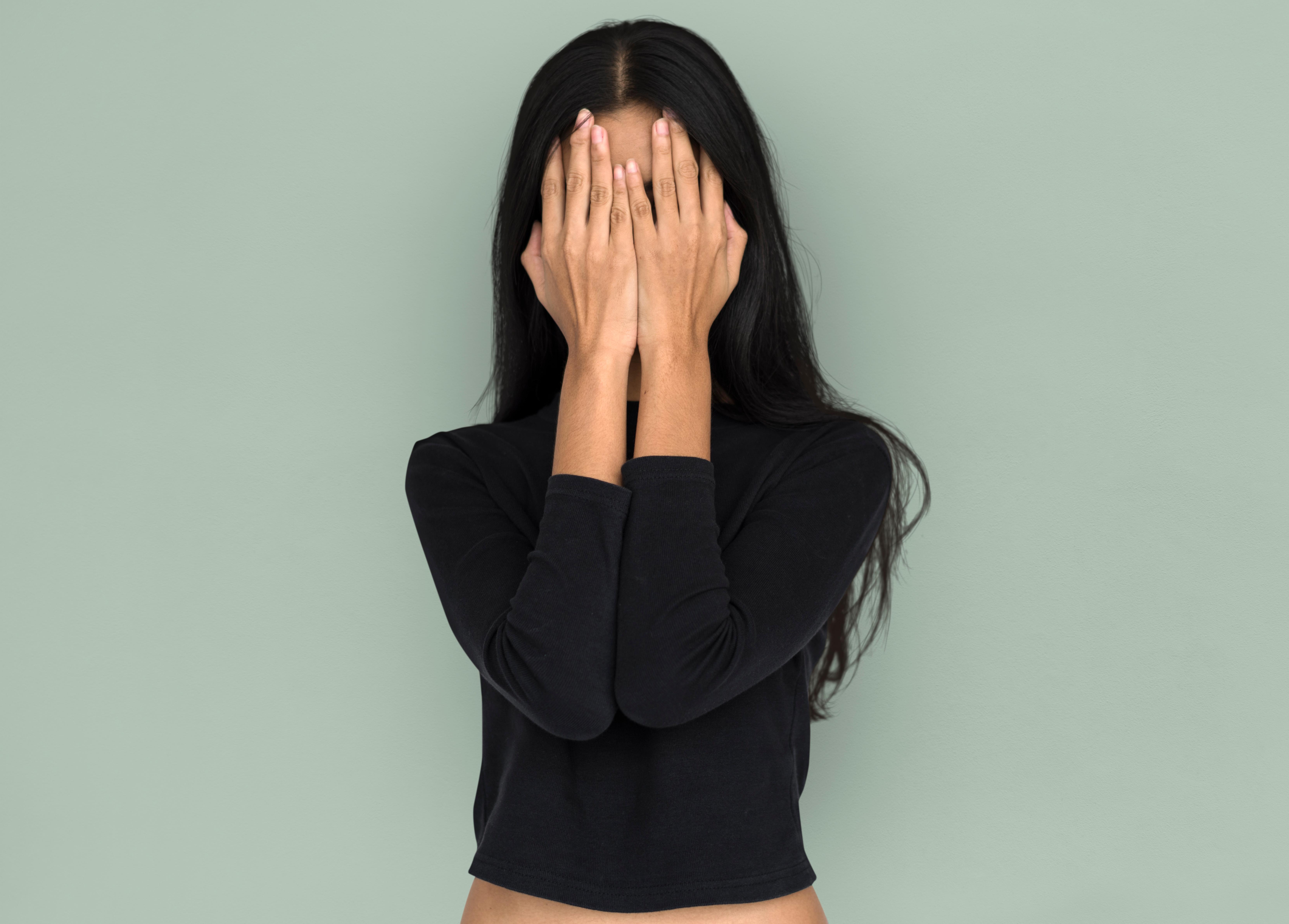 woman hiding her face, Restorative Dentistry